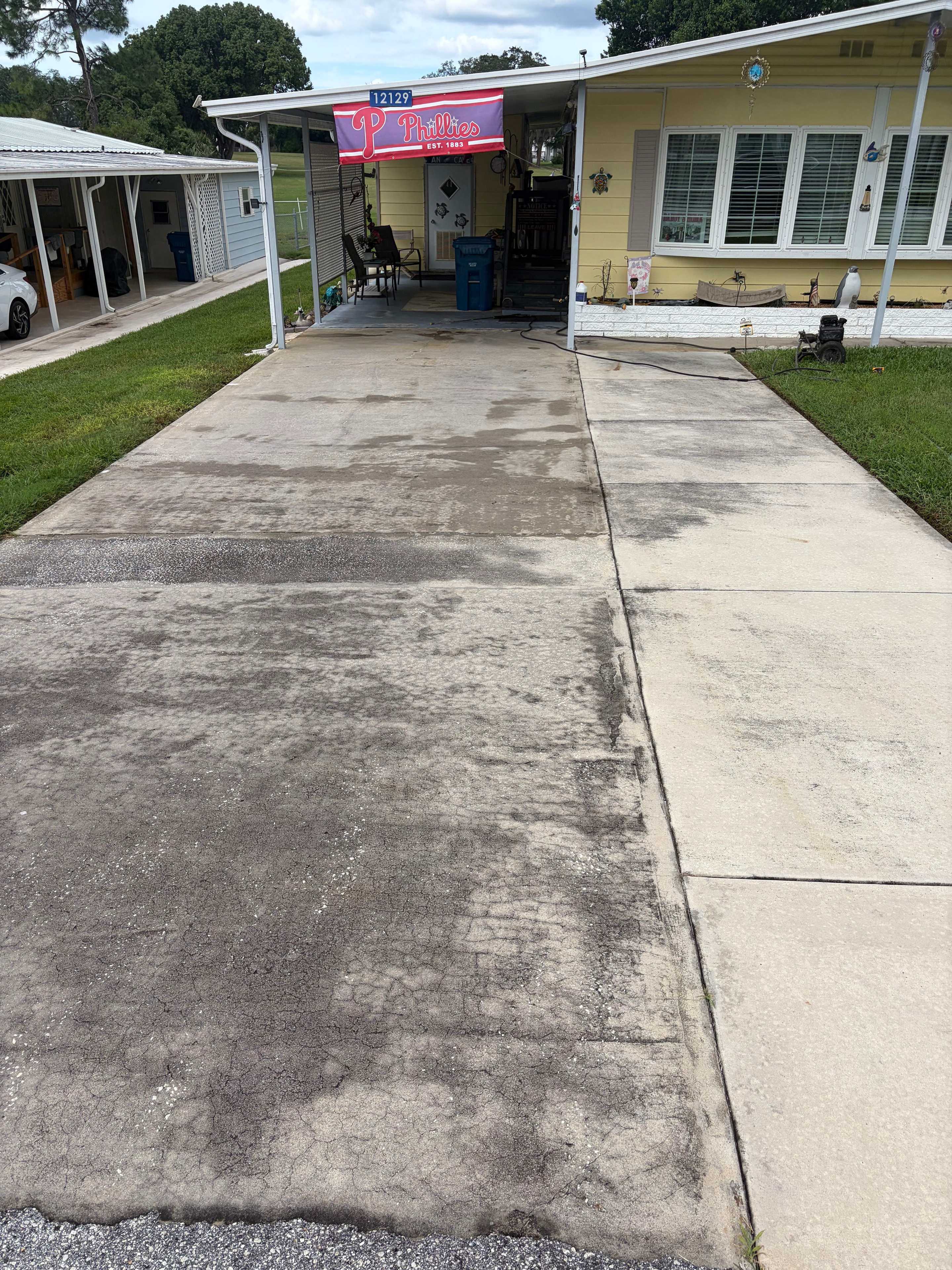 Heavily stained driveway before pressure washing